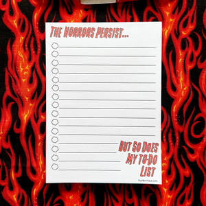 Notepad with a to-do list on a fiery background