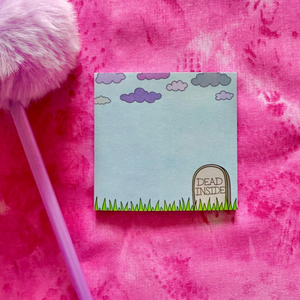 Sticky notepad with a grave design on a pink textured background