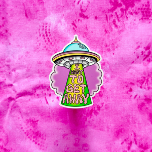 UFO sticker with text 'I Want To Get Away' on a pink and white marbled background
