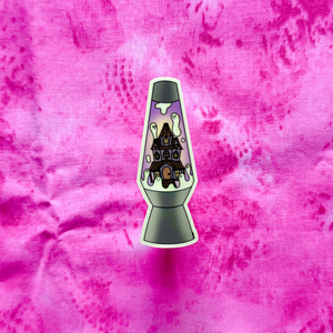 Lava lamp with haunted house design on a pink textured background