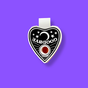 Ouija planchette magnetic pendant with 'GOODBYE' & 'Hello' text on a purple background