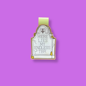Gothic-style tombstone magnetic bookmark with 'Here Lies My Endless TBR' text on a purple background